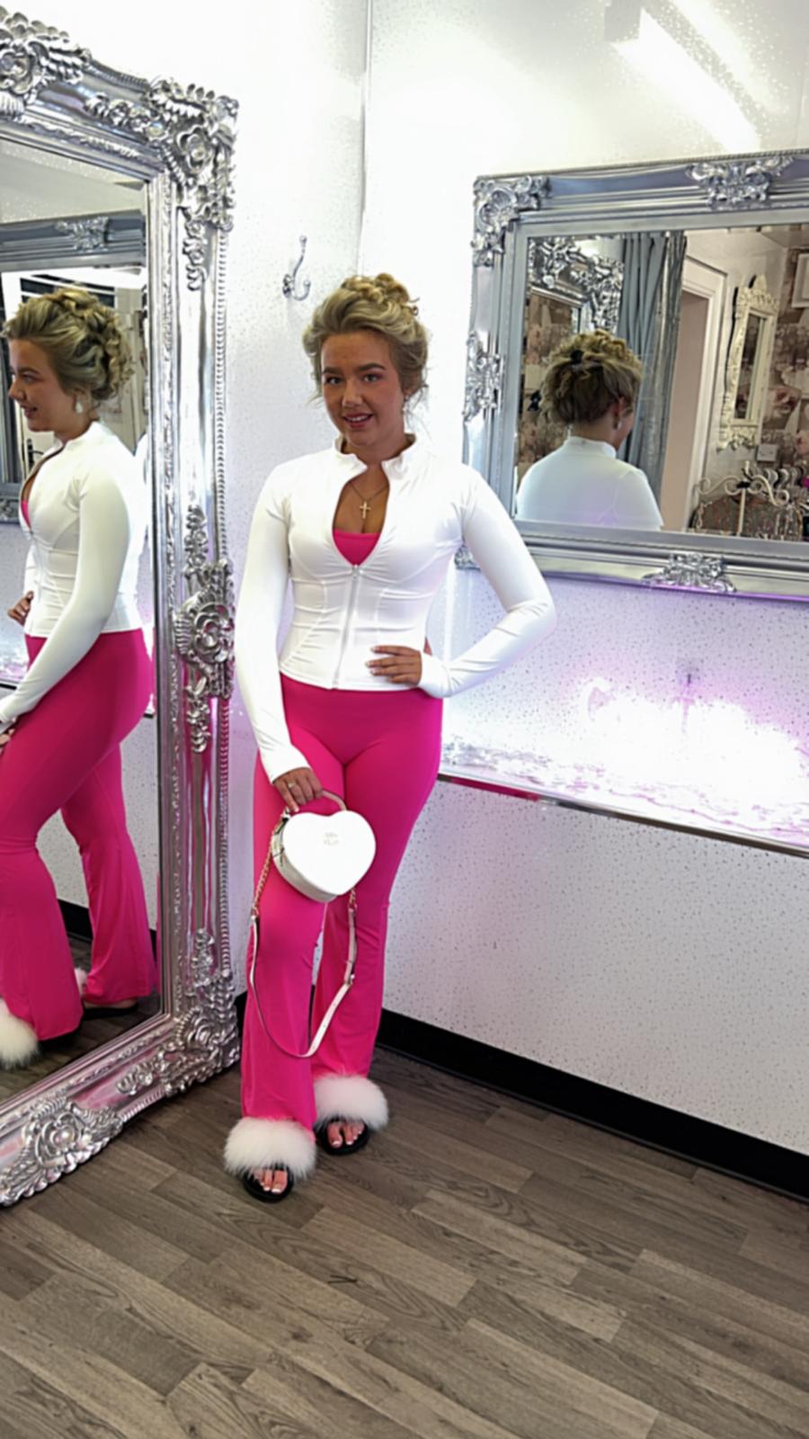 pink fine ribbed jumpsuit with flared bottoms and bandeaux style top